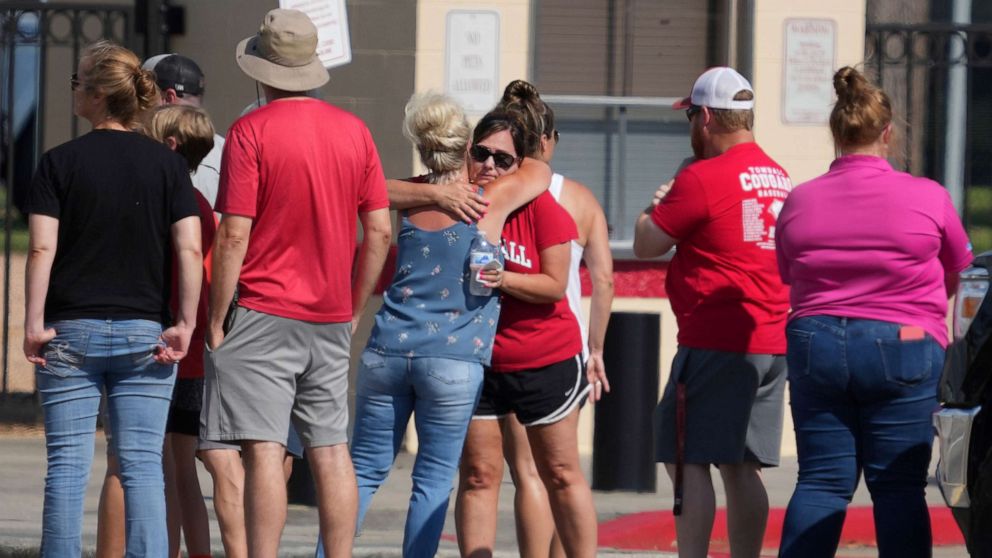 PHOTO: People gather for a community vigil at Tomball High School for the five members of an area family who were killed by an escaped prisoner on June 3, 2022, in Tomball, Texas. 