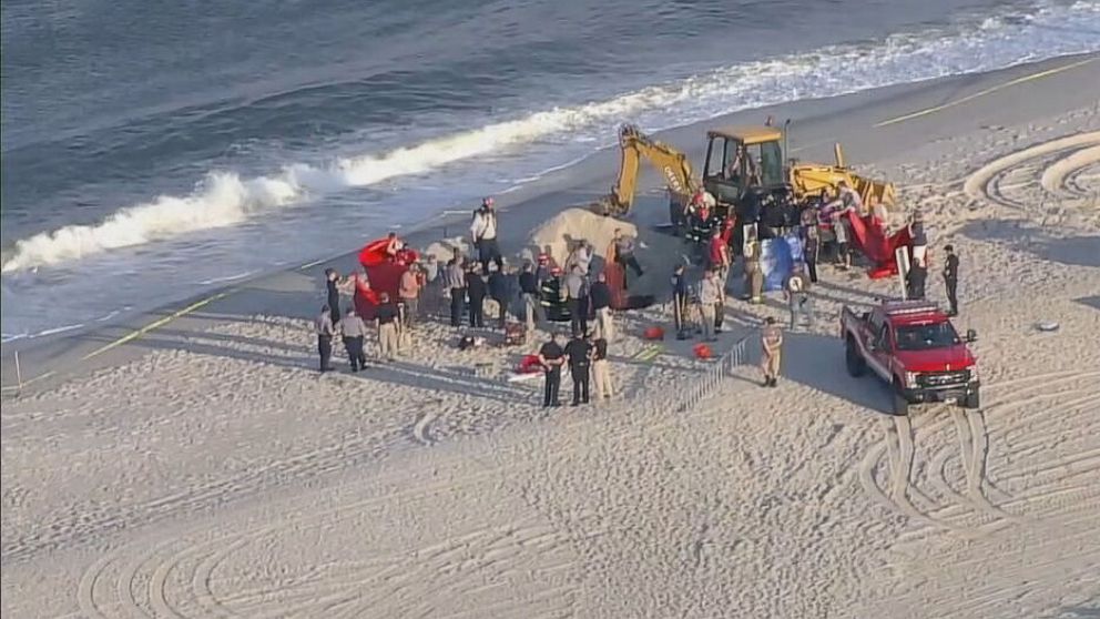 PHOTO: First responders on the scene of a sand collapse at a beach in Toms River, New Jersey, May 17, 2022.