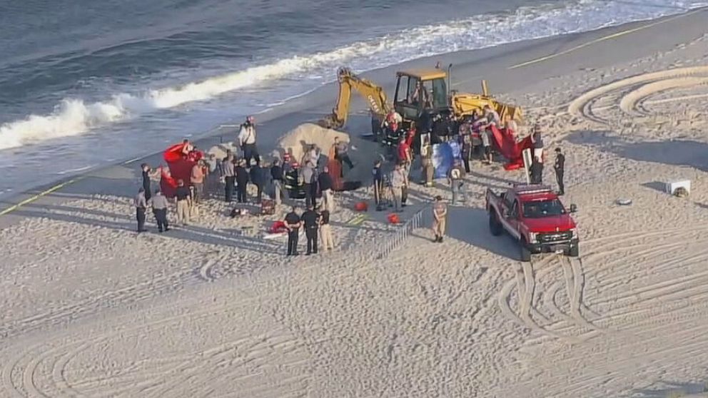 PHOTO: First responders on the scene of a sand collapse at a beach in Toms River, New Jersey, May 17, 2022.