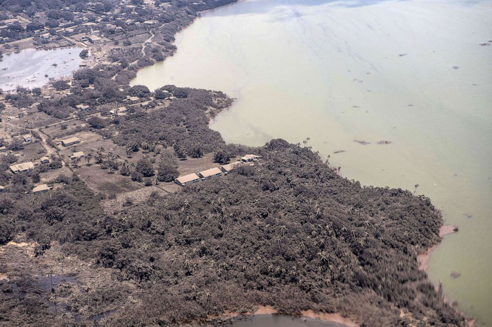 PHOTO: An aerial view from a surveillance plane shows homes covered with heavy ash covering Nomuka, Tonga on Jan. 17, 2022, in a handout photo provided by the New Zealand Defense Force.