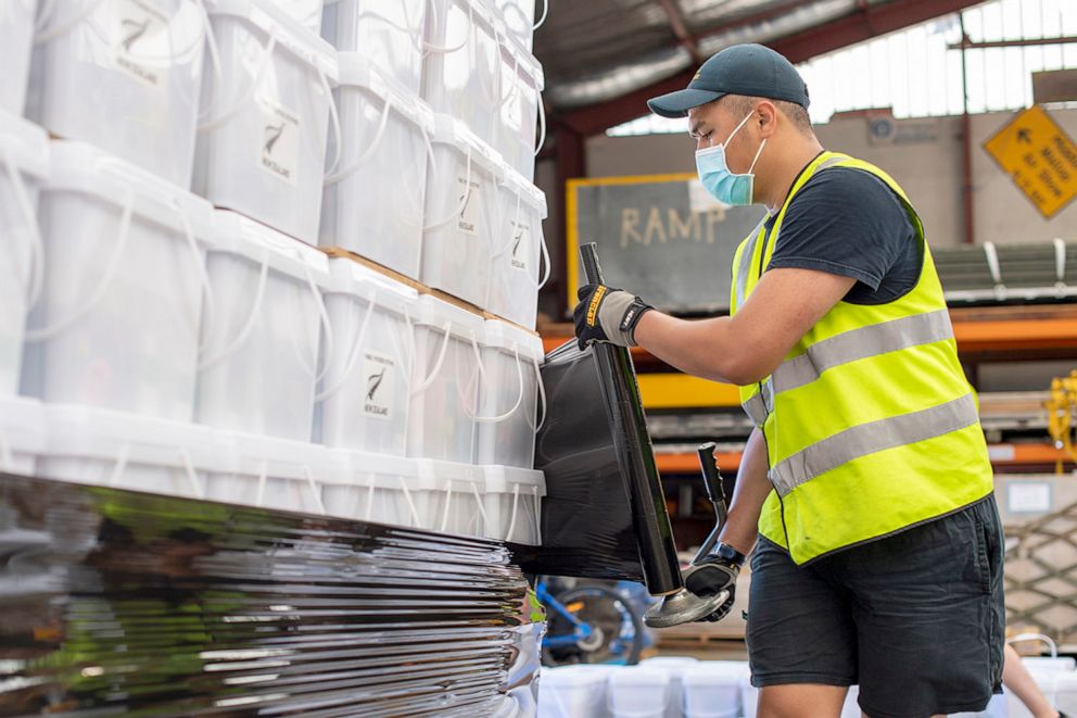 PHOTO: In this handout photo provided by the New Zealand Defense Force, personnel stack and secure pallets of disaster relief supplies to be sent to by Royal New Zealand Air Force C-130 to Tonga on Jan. 17, 2022 near Nomuka, Tonga. 