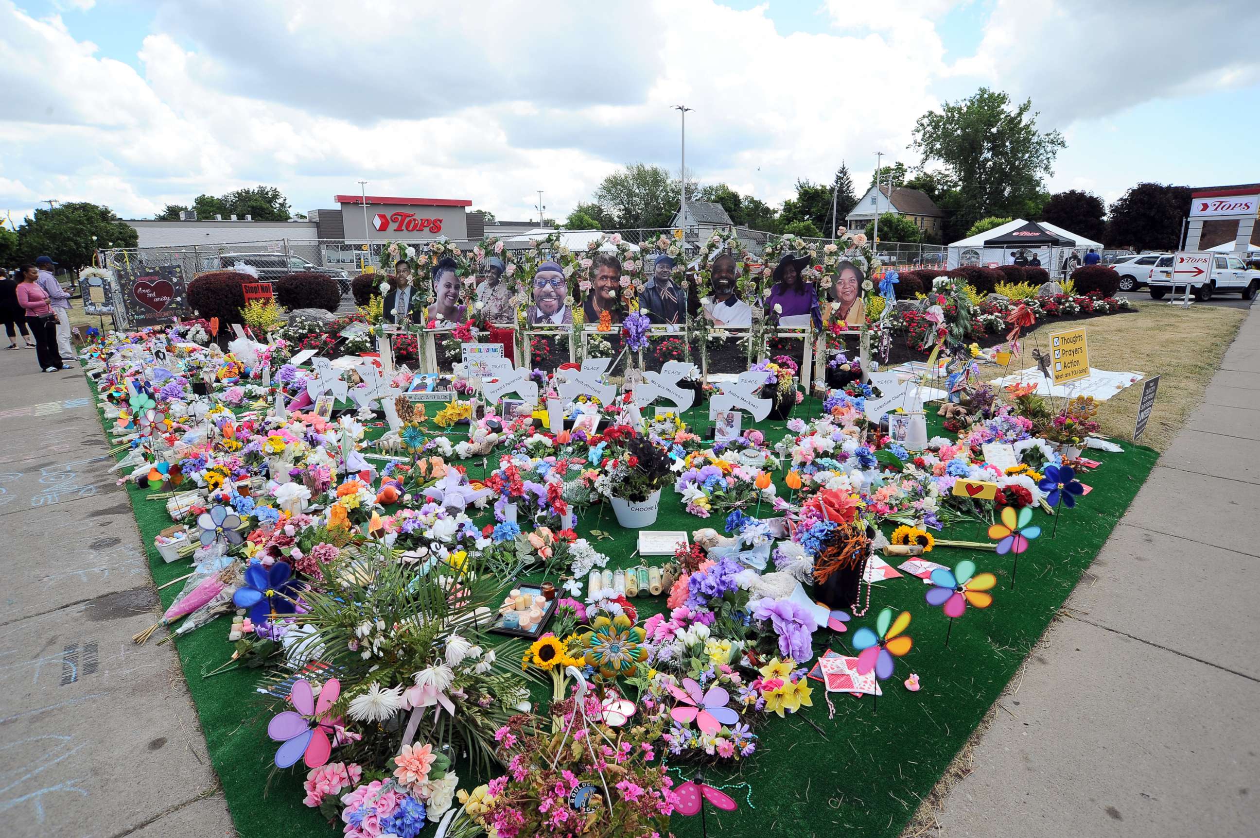 PHOTO: A makeshift memorial filled with flowers, photos and mementos outside the Tops Friendly Market, July 14, 2022, in Buffalo, N.Y.