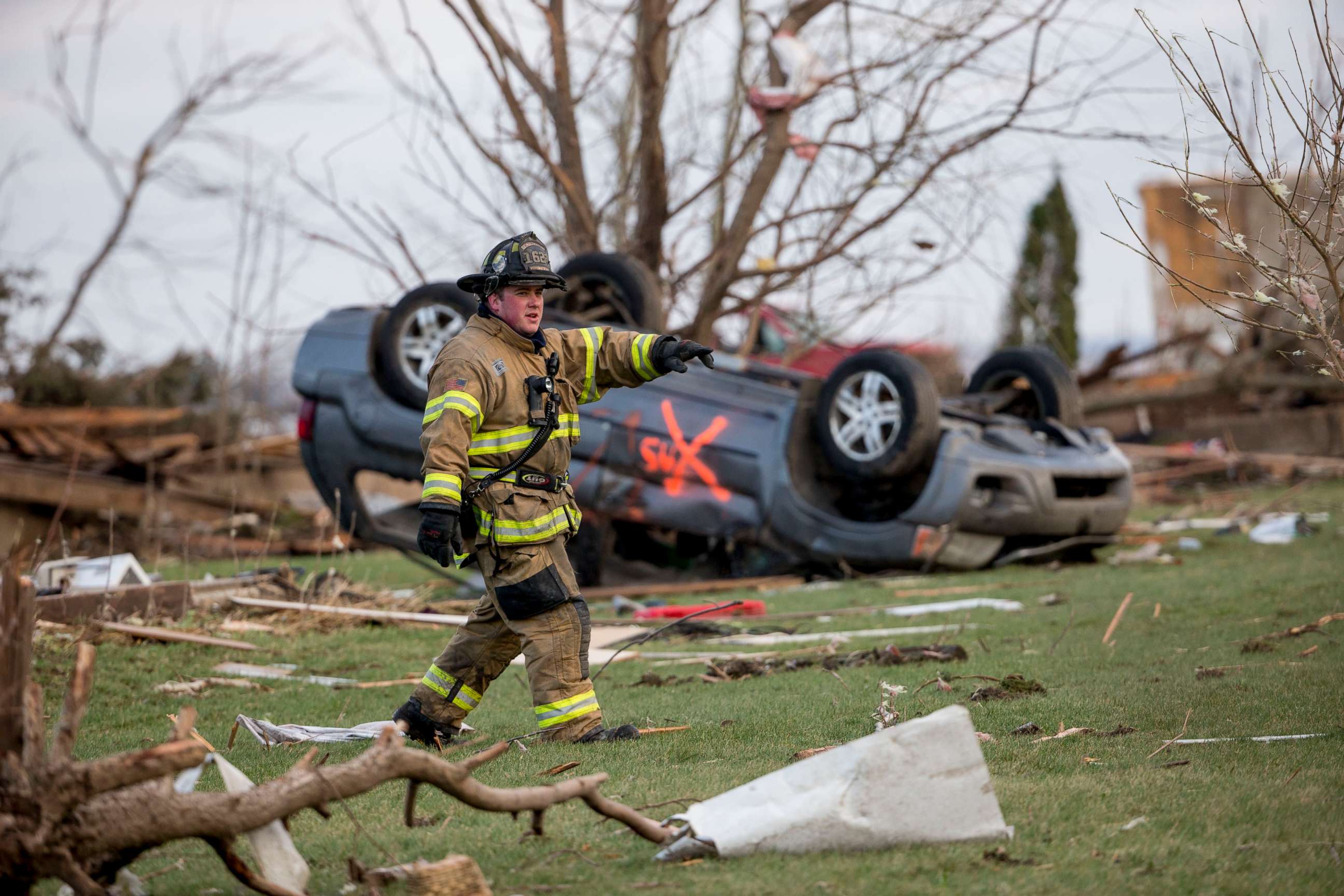 PHOTO: Crews search through Fairdale, Ill., for unaccounted people the morning after a tornado swept through the town on April 10, 2015.