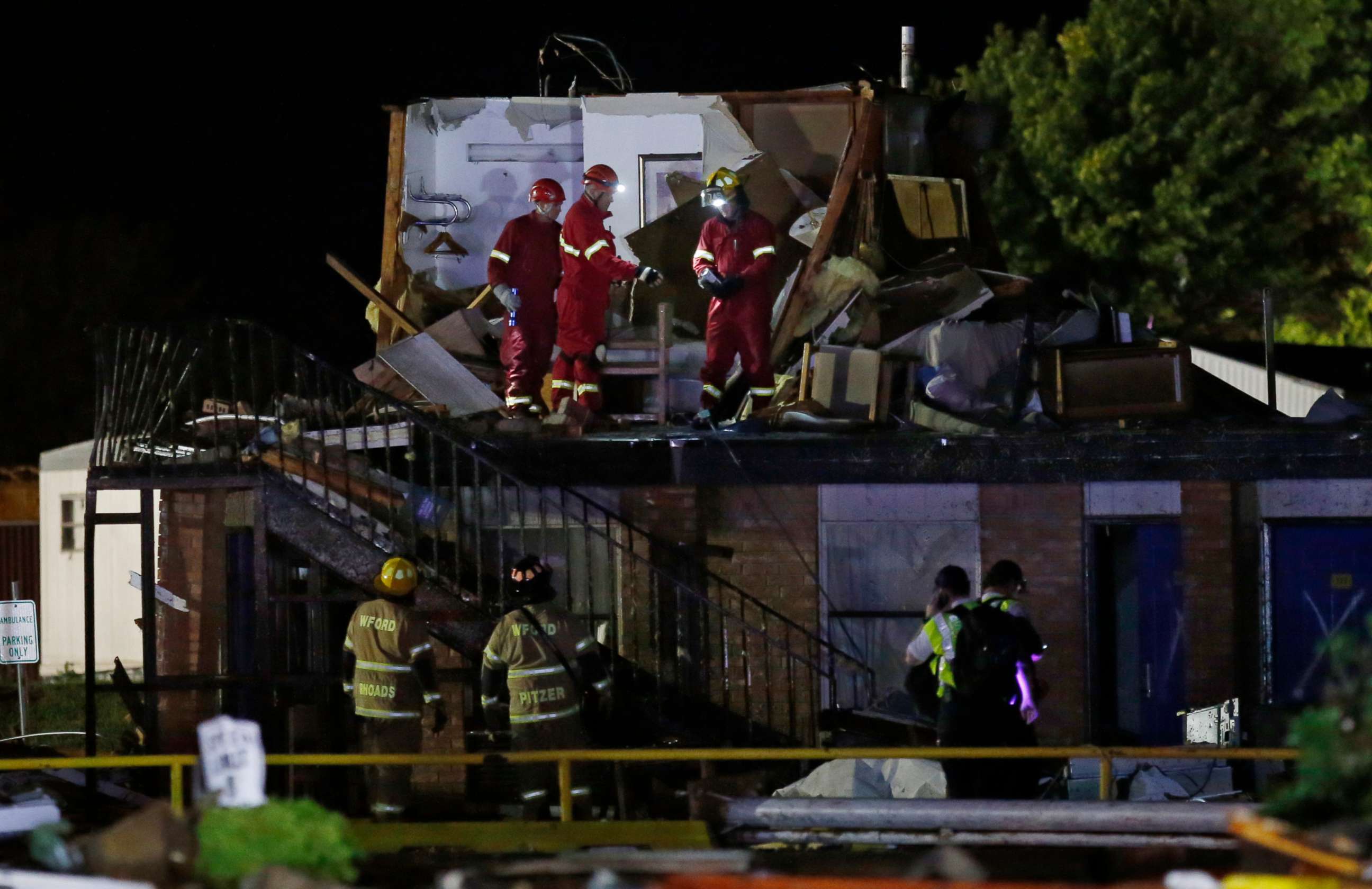 PHOTO: Emergency workers check what is left of the second floor of a hotel, May 26, 2019, in El Reno, Okla., following a tornado.