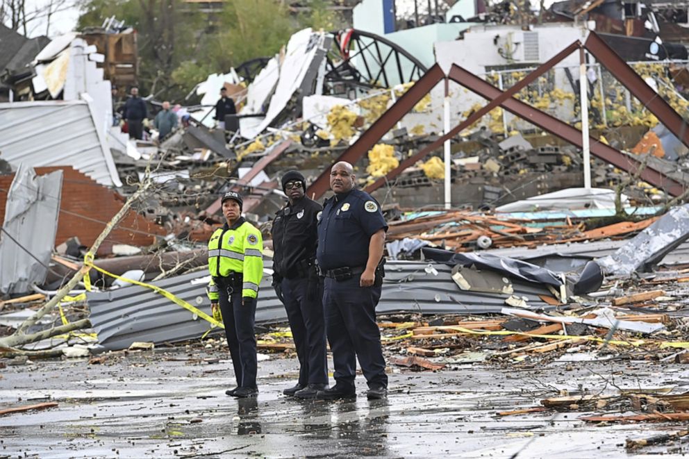 PHOTO: Police officers view damage along Woodland Street after a tornado touched down in Nashville, Tenn. March 3, 2020. 