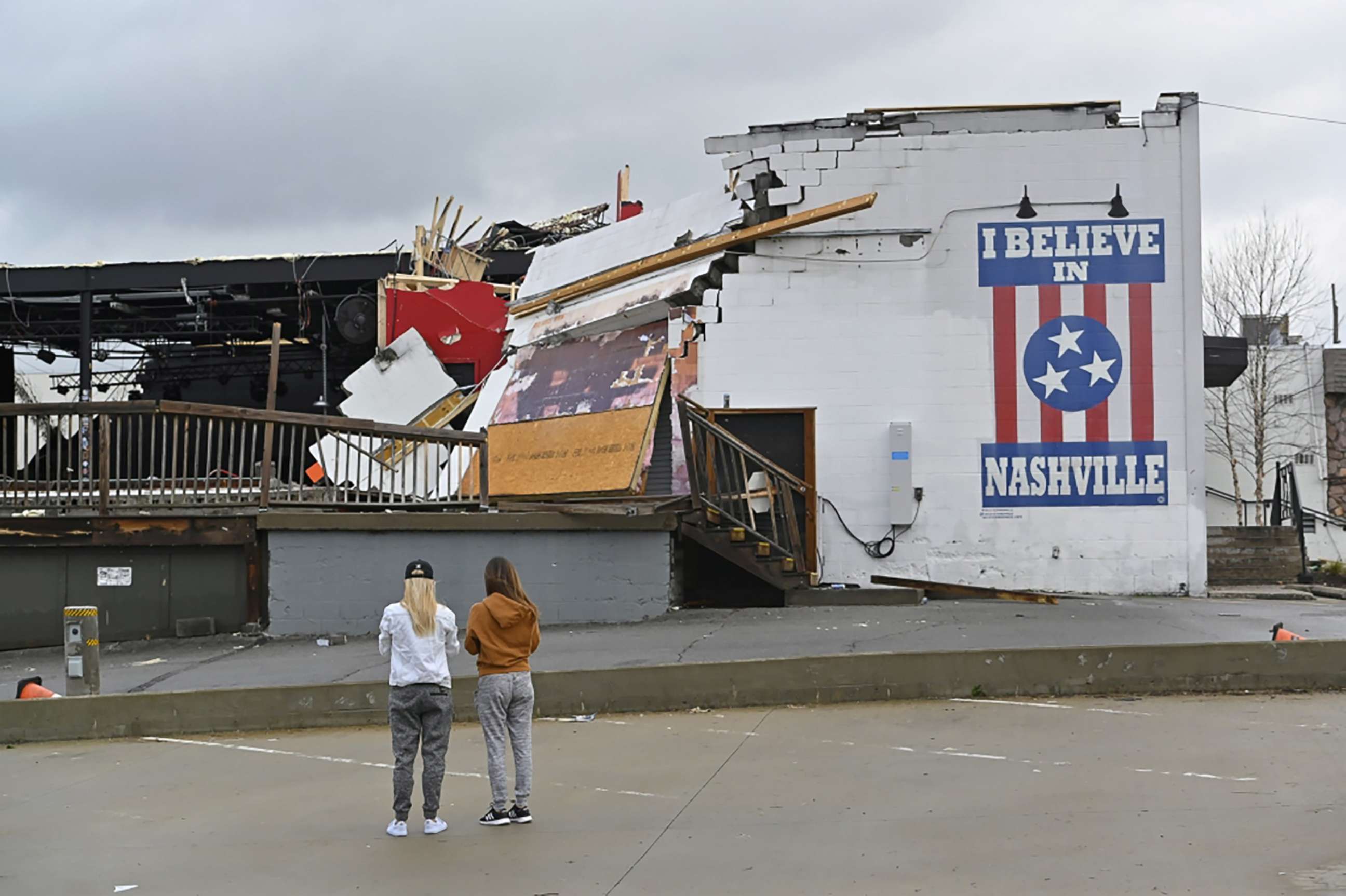 PHOTO: Women view damage at the Basement East music venue after a tornado touched down in Nashville, Tenn., March 3, 2020.  