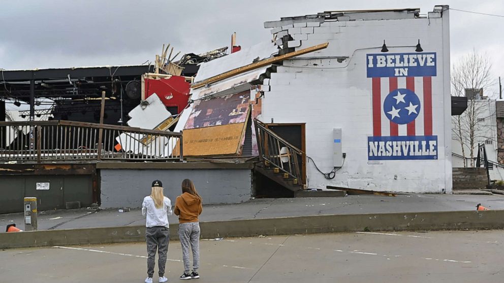 PHOTO: Women view damage at the Basement East music venue after a tornado touched down in Nashville, Tenn., March 3, 2020. 