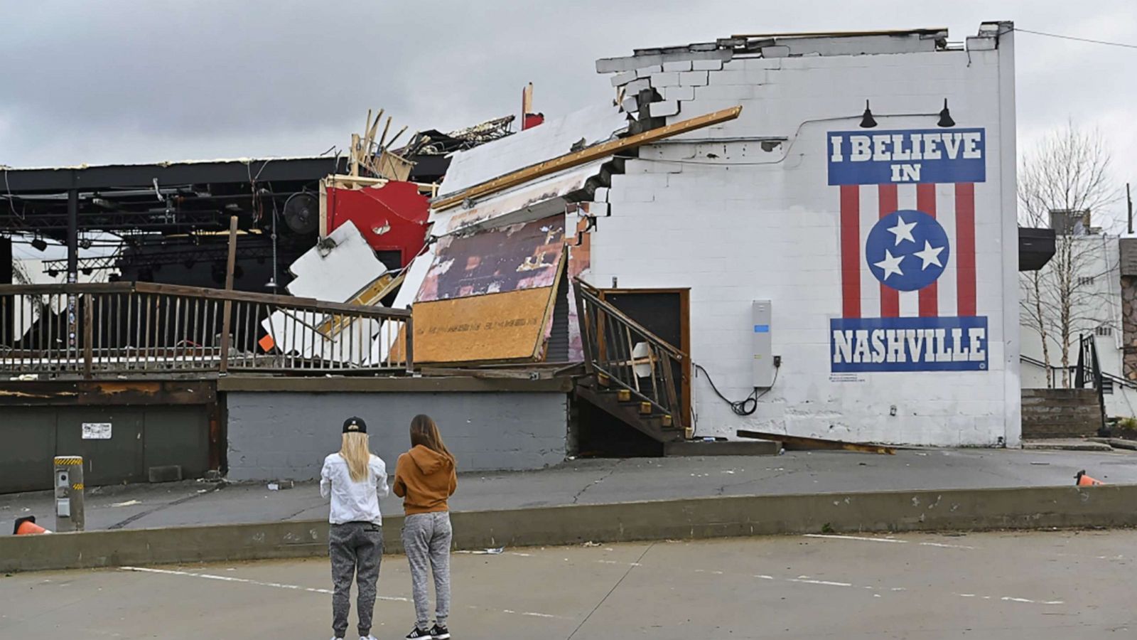 PHOTO: Women view damage at the Basement East music venue after a tornado touched down in Nashville, Tenn., March 3, 2020.