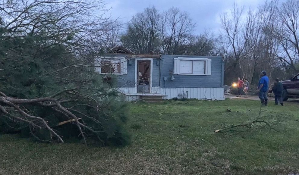 PHOTO: Residents look at damage to their house after a tornado passed through Hopkins County, Texas, Mar. 2, 2023.