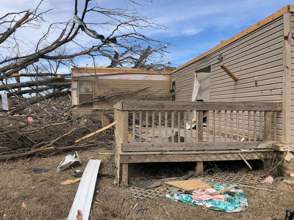 PHOTO: Just days after Dr. Jared Burks' wife snapped a photo of him visiting his son through a glass door during the coronavirus outbreak a tornado ripped through his community and destroyed his home.