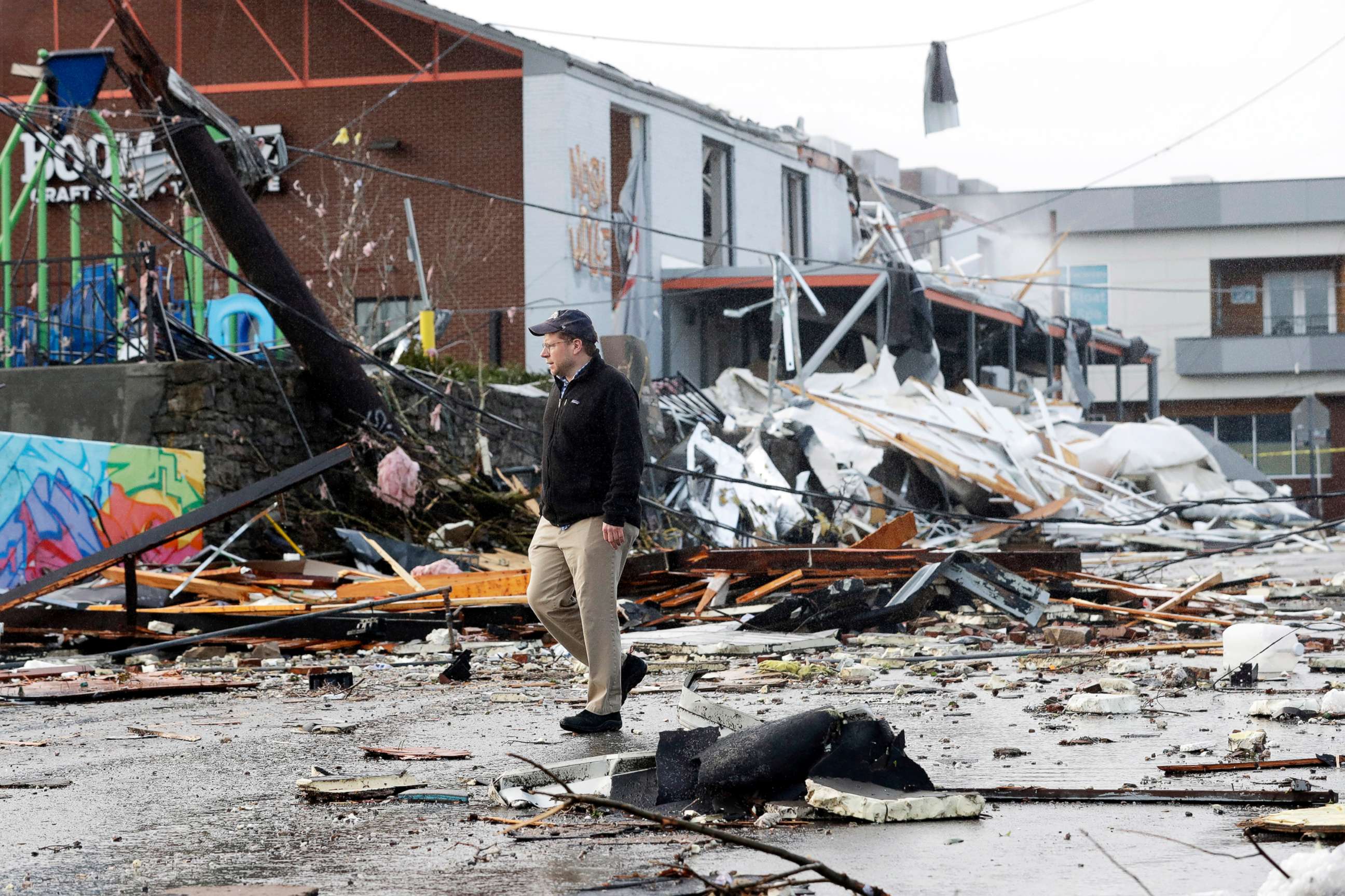 PHOTO: A man walks past storm debris following a deadly tornado, March 3, 2020, in Nashville, Tenn.