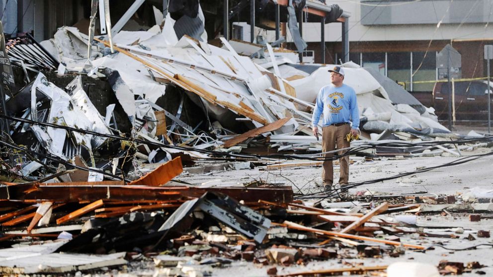 PHOTO: A man looks over buildings destroyed by storms, March 3, 2020, in Nashville, Tenn.