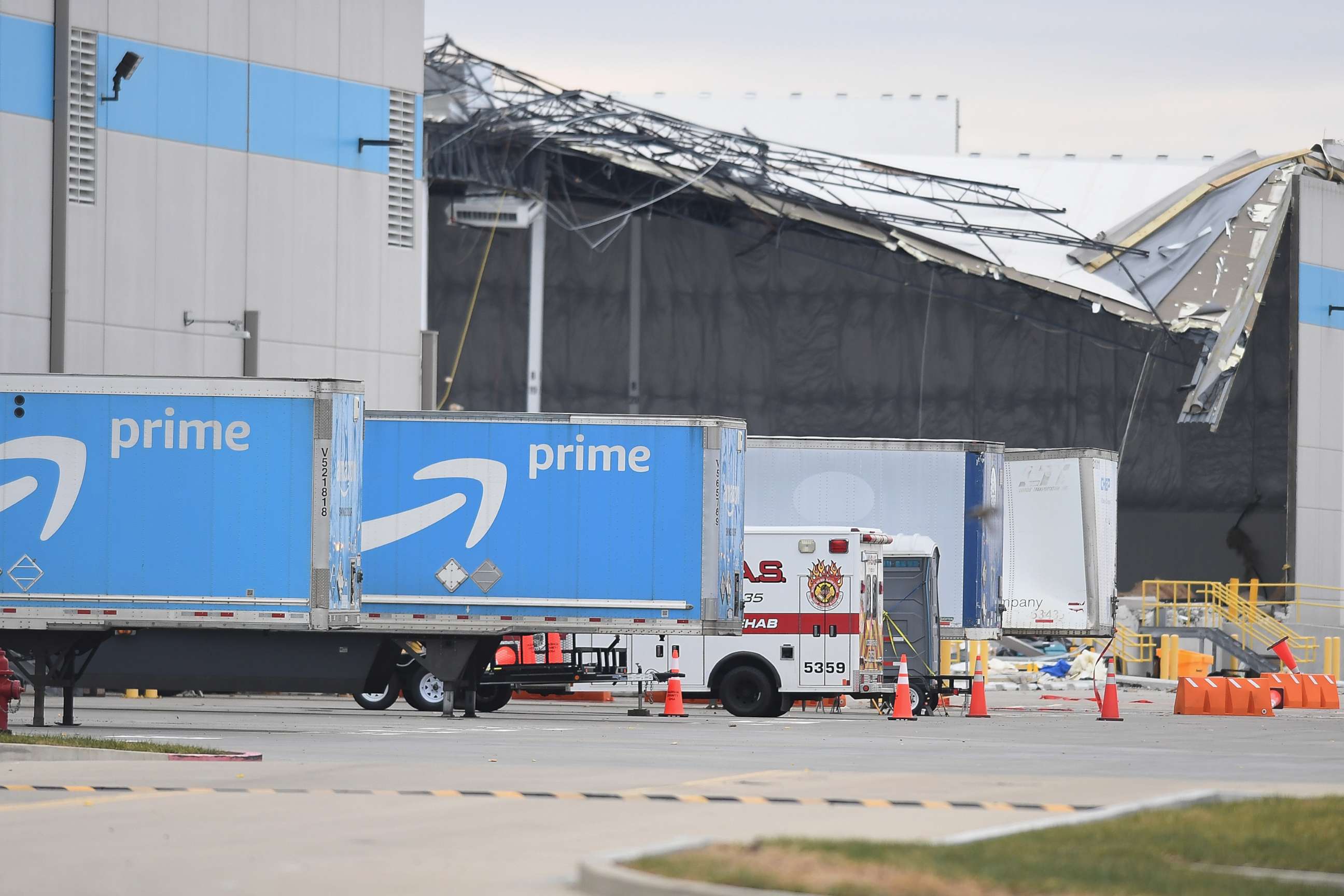 PHOTO: Amazon truck cabs are seen outside a damaged Amazon Distribution Center after it was hit by a tornado, Dec. 11, 2021, in Edwardsville, Ill.