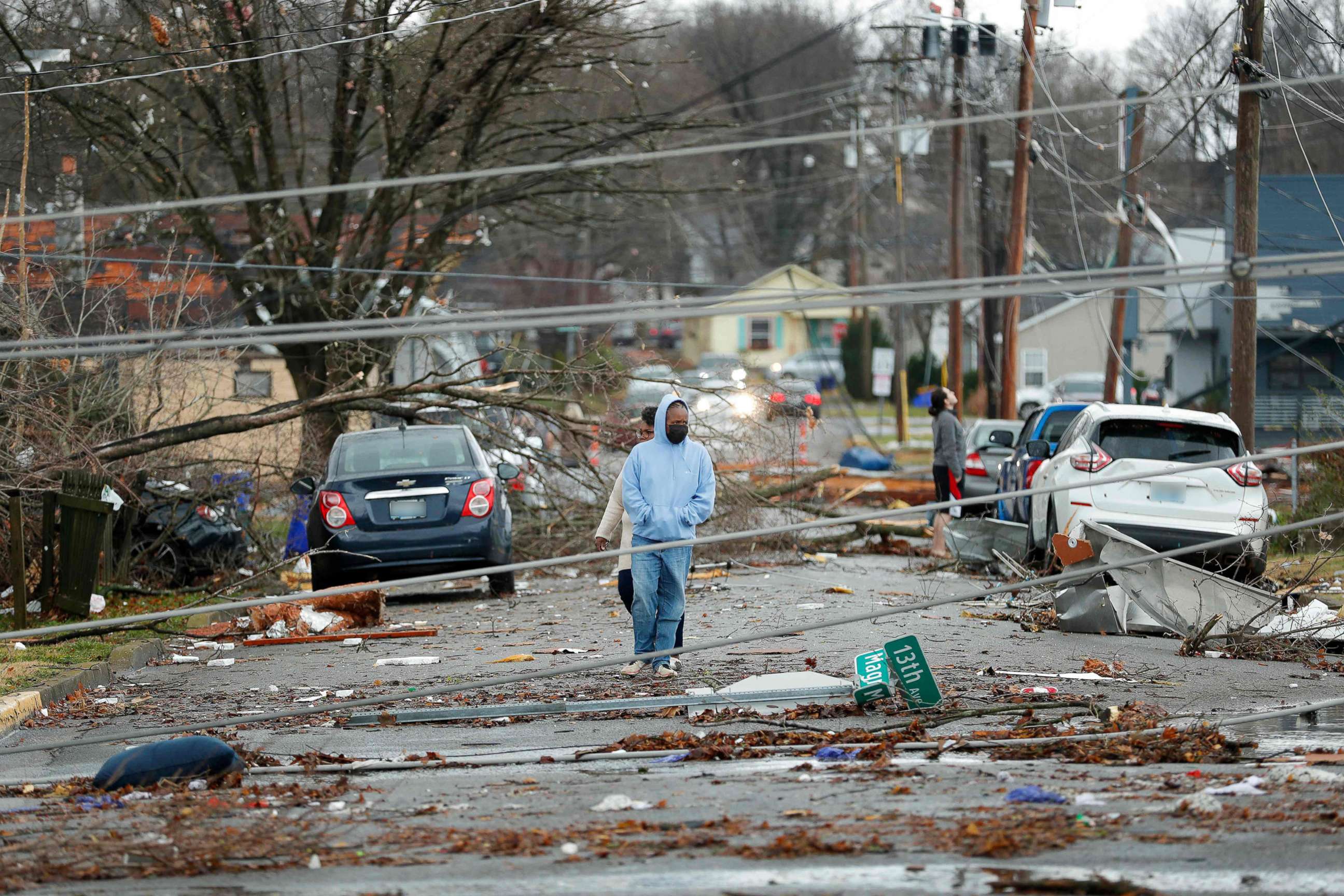 PHOTO: Residents look at the damage following a tornado that struck the area, Dec. 11, 2021, Bowling Green, Ky.