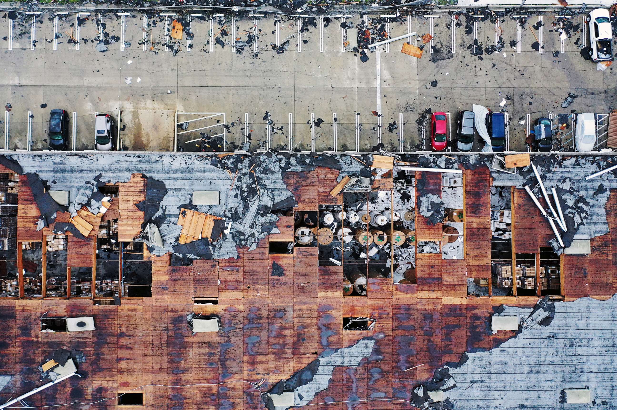 PHOTO: An aerial view of roof damage after a rare confirmed tornado touched down and ripped up building roofs in a Los Angeles suburb of Montebello, March 22, 2023.