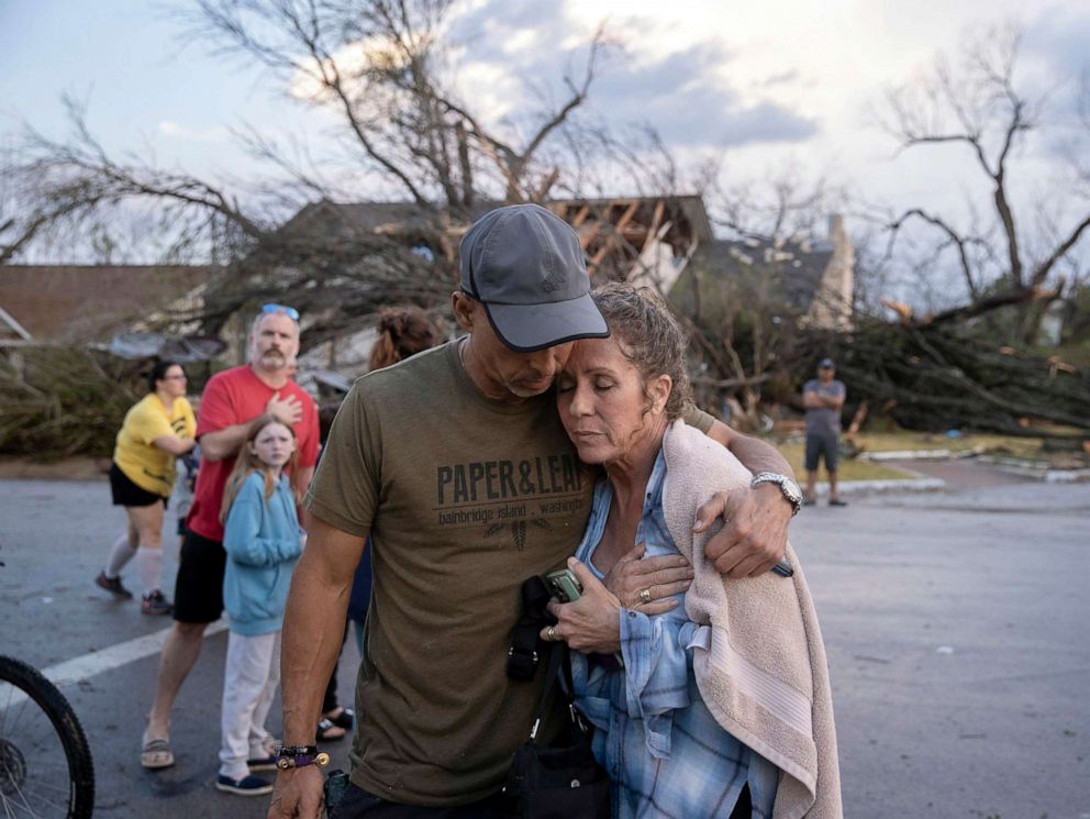 PHOTO: Michael Talamantez comforts his girlfriend Derry Schroer after his house was destroyed by a tornado while they were inside, March 21, 2022, in Round Rock, outside Austin, Texas.