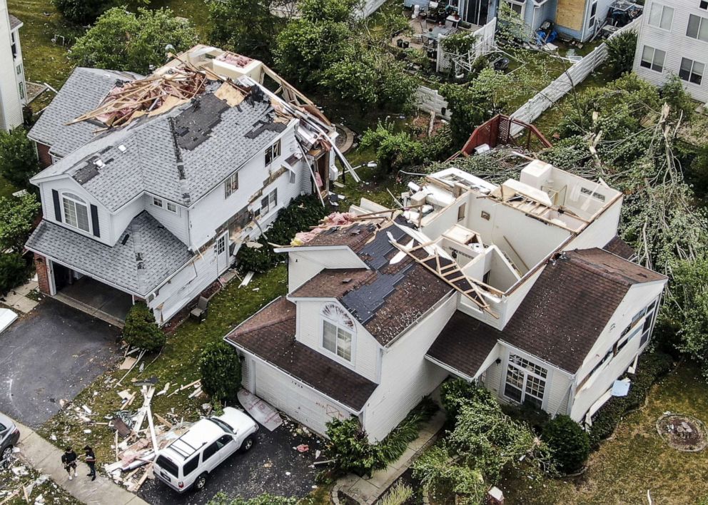 PHOTO: An aerial photo made with a drone shows damage after a tornado hit in a neighborhood in Naperville, Il., June 21, 2021.