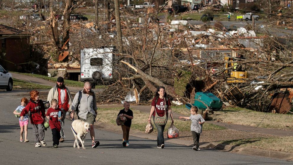 PHOTO: A family evacuates their Walnut Ridge neighborhood on March 31, 2023, in Little Rock, Arkansas.