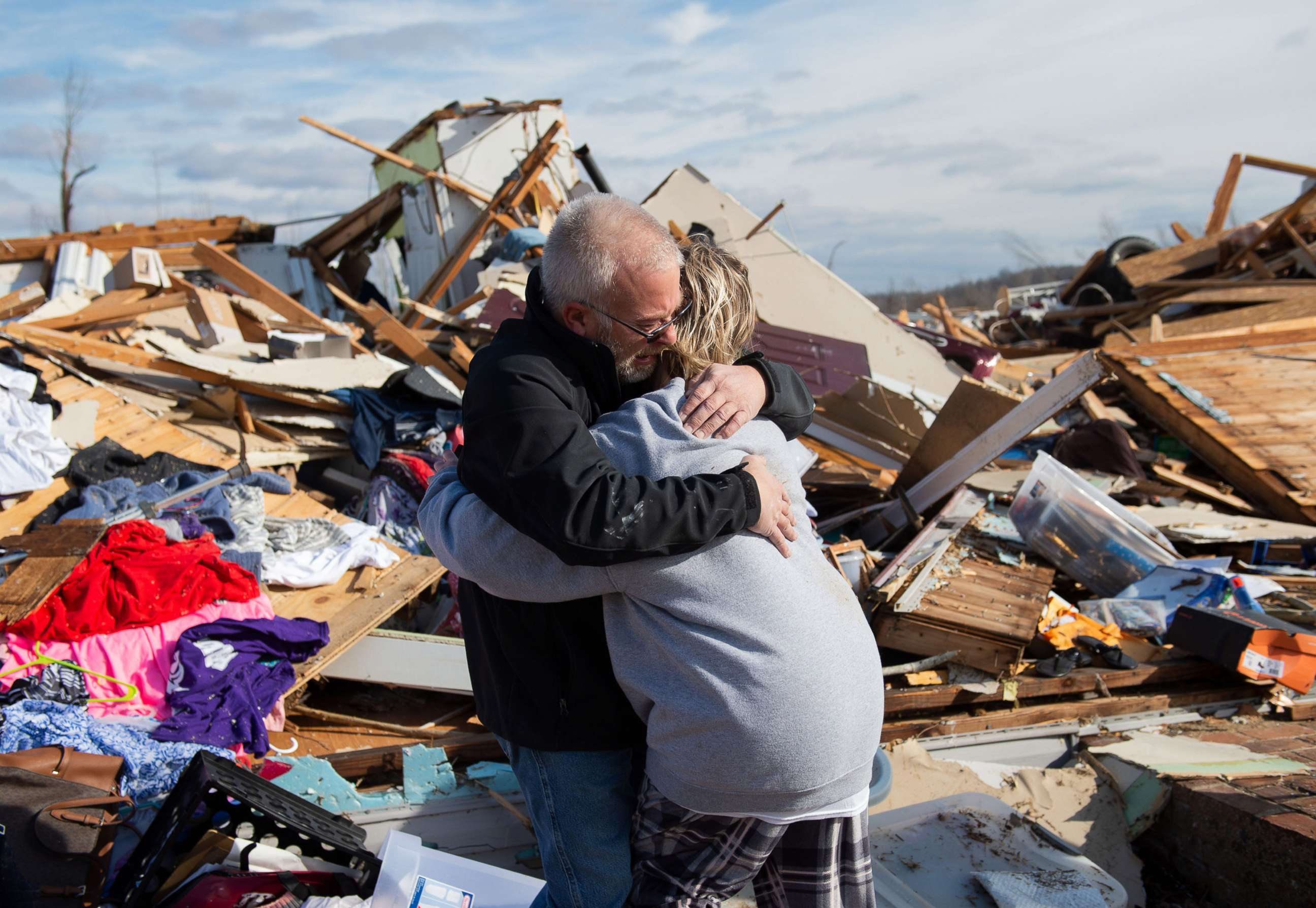 PHOTO: Mike Castle, left, hugs his daughter Nikki Castle, after locating the father-daughter necklace he meant to gift to Nikki for Christmas after the tornado in Dawson Springs, Ky., Dec. 11, 2021.