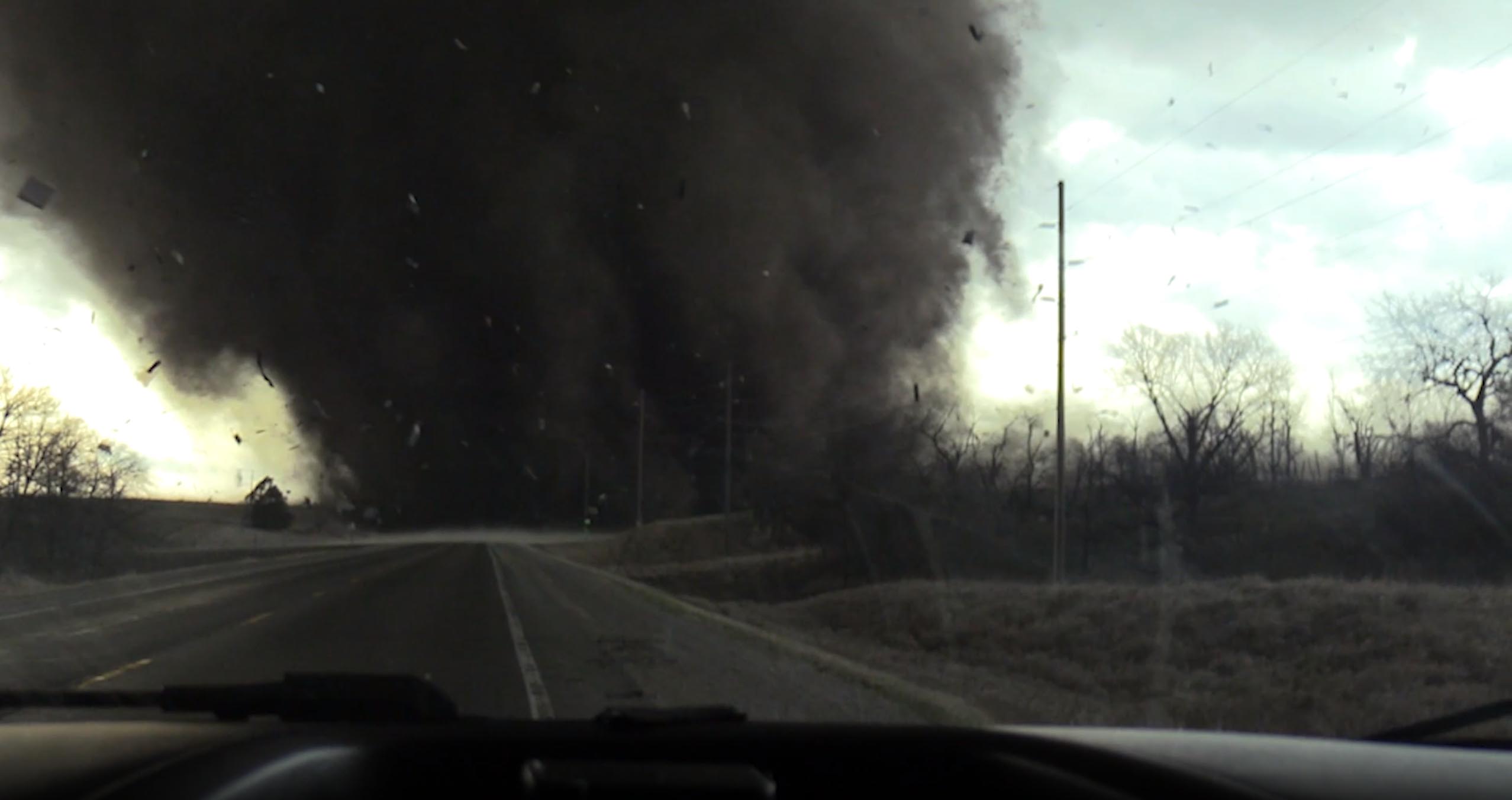 PHOTO: In this screen grab from a video, a tornado crosses a road in Harper, Iowa, on March 31, 2023.