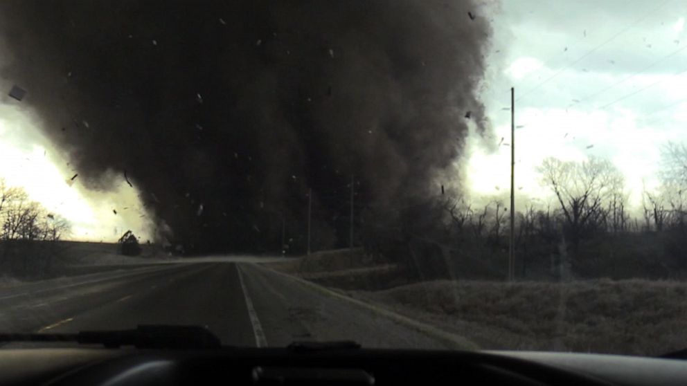 PHOTO: In this screen grab from a video, a tornado crosses a road in Harper, Iowa, on March 31, 2023.