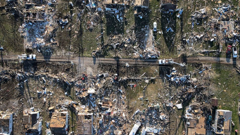 PHOTO: Destroyed homes and utility crews are seen in a neighborhood in the aftermath of a tornado in Sullivan, Indiana, April 2, 2023.