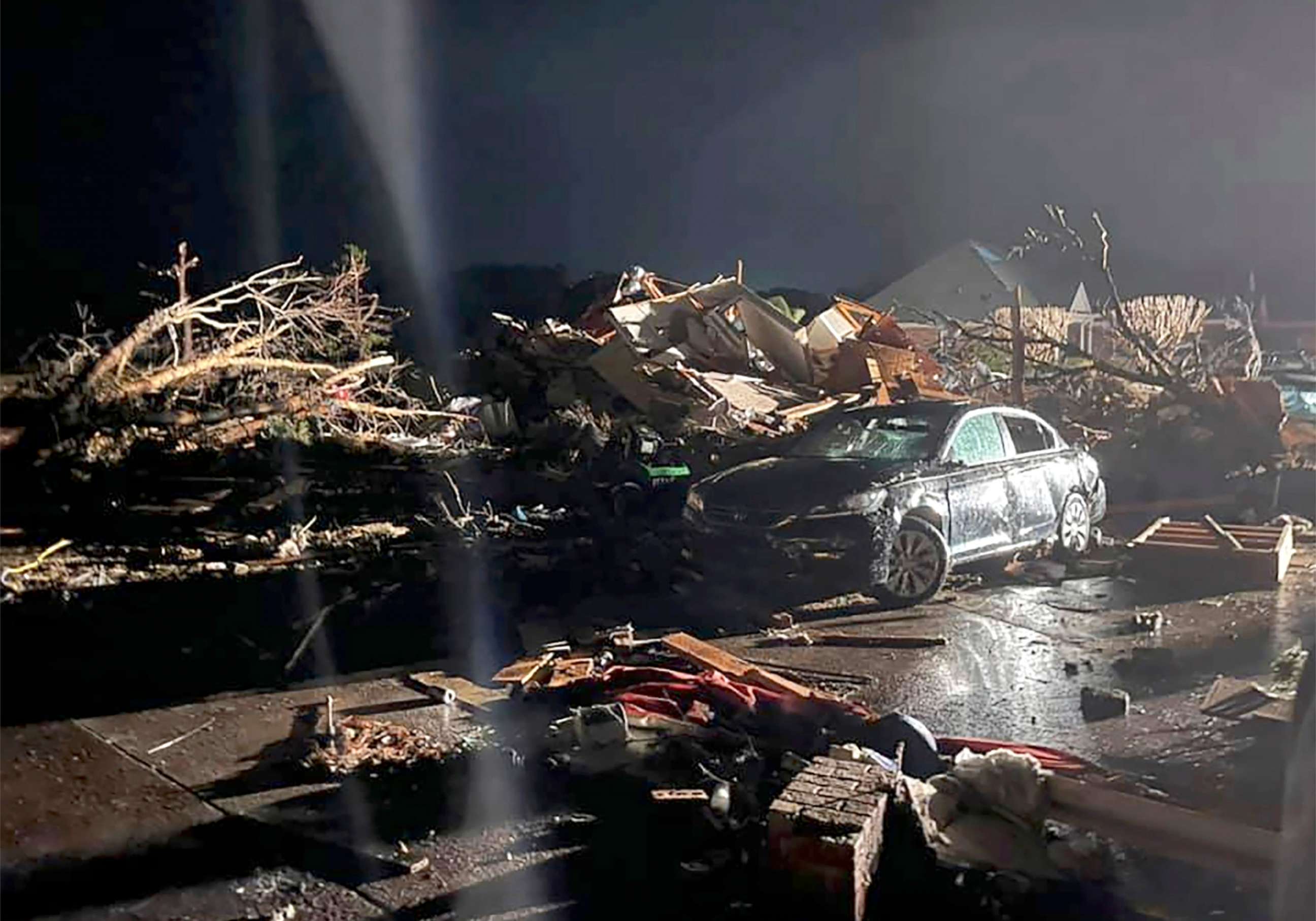 PHOTO: A damaged vehicle sits among debris after a deadly tornado tore through Brunswick County, N.C., Feb. 16, 2021.