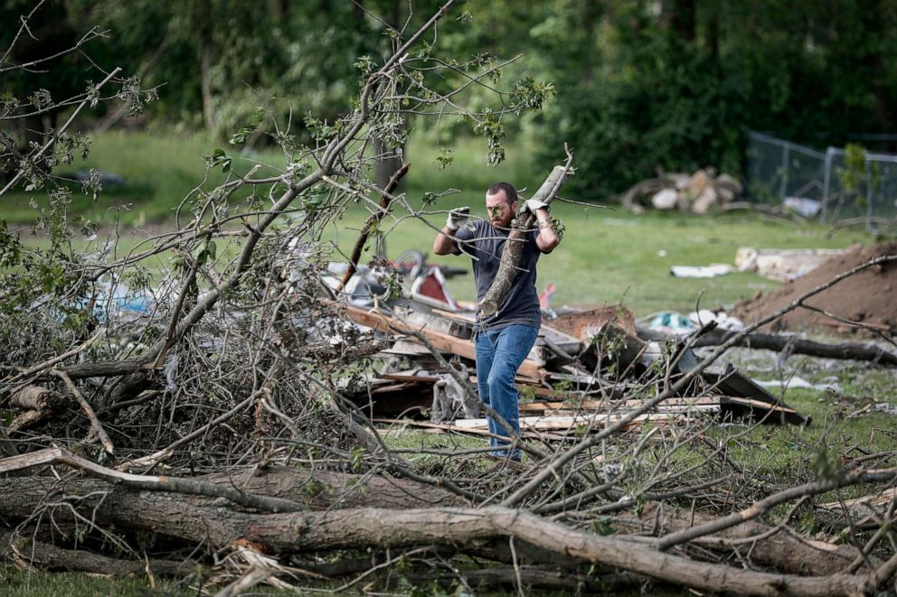 PHOTO: Residents and volunteers help clear debris from damaged homes resulting from a tornado storm system, May 28, 2019, in Brookville, Ohio.