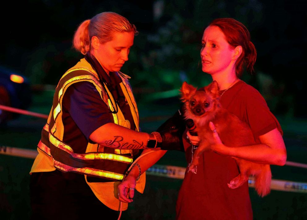 PHOTO: A woman received medical attention after an apparent tornado touched down Wednesday, April 22, 2020, in Onalaska, Texas.