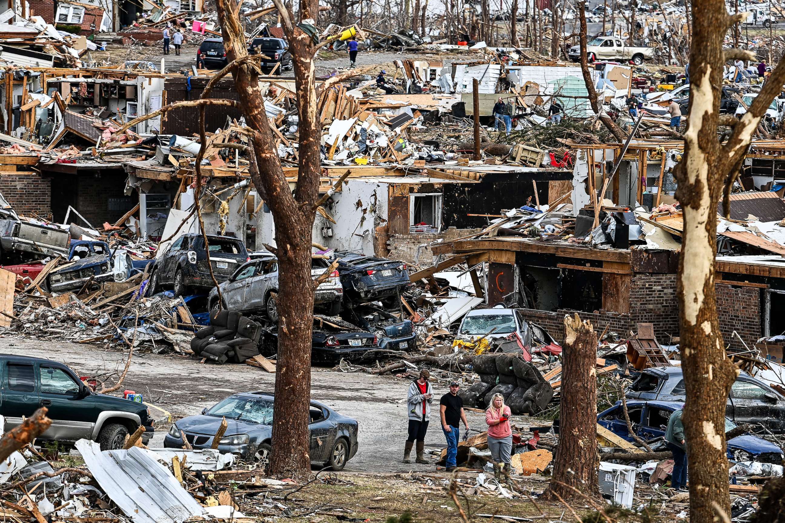 PHOTO: People clear their destroyed homes in Dawson Springs, Ky., Dec. 14, 2021, four days after tornadoes hit the area.