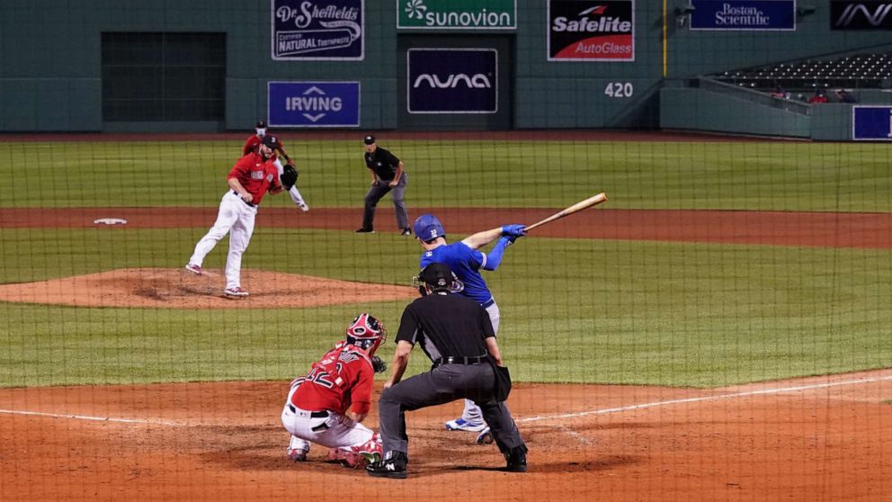 PHOTO: Toronto Blue Jays center fielder Derek Fisher hits a three-run home run to take the lead against the Boston Red Sox in the ninth inning at Fenway Park in Boston, July 21, 2020.