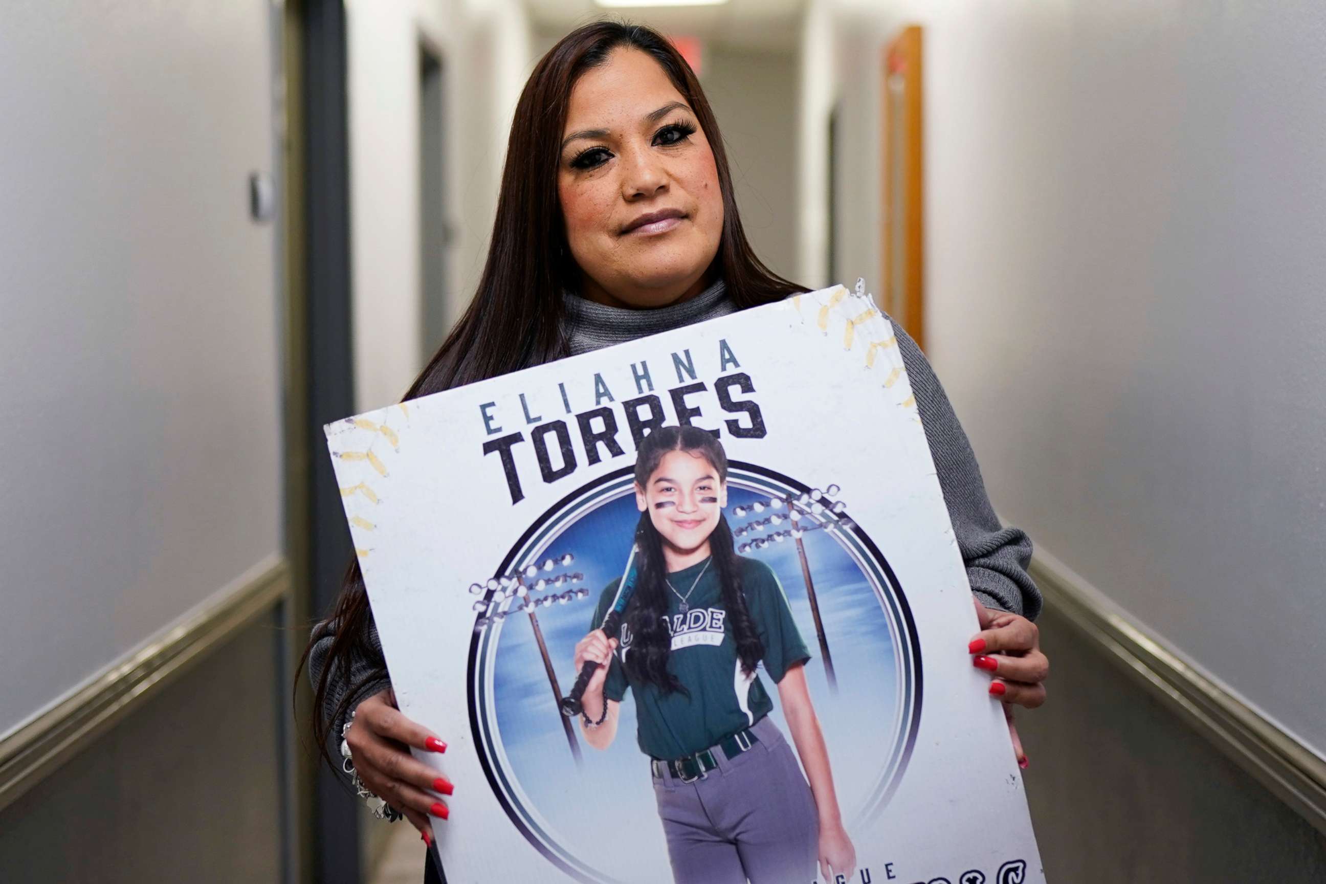PHOTO: Sandra Torres, holds a photo of her daughter Eliahna, who was one of 19 students and two teachers killed in the school shooting in Uvalde, Texas, at her attorney's office, Monday, Nov. 28, 2022, in San Antonio.