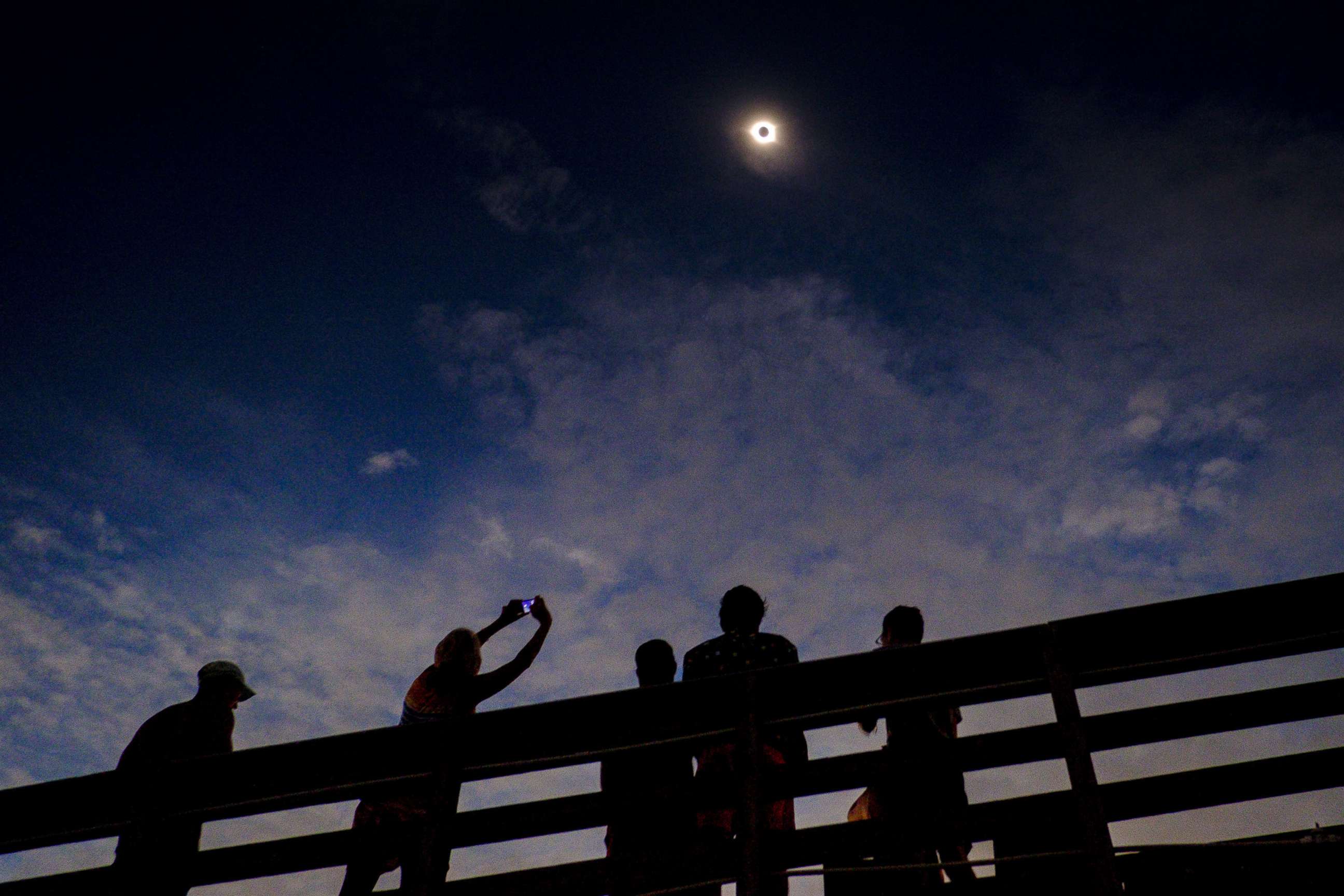 PHOTO: Solar eclipse watchers were ecstatic as the clouds broke minutes before totality during the total solar eclipse, Aug. 21, 2017, in Isle of Palms, S.C.