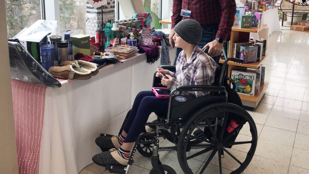 Patient Averie Green looks at toys in the "Santa Store" at Sacred Heart Children's Hospital in Spokane, Wash., Dec. 20, 2018.