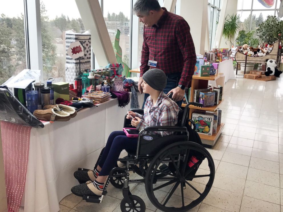 PHOTO: Patient Averie Green looks at toys in the Santa Store at Sacred Heart Childrens Hospital in Spokane, Wash., Dec. 20, 2018.