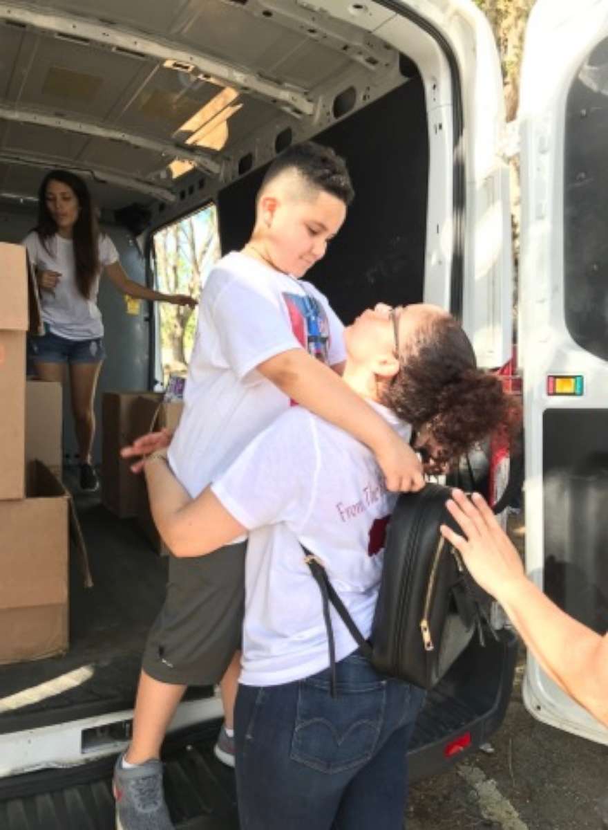 PHOTO: Jayden Perez, 8, and his mother, Ana Rosado. Rosado said the family traveled to eight destinations in Puerto Rico, handing out toys, goodie bags and toiletries.
