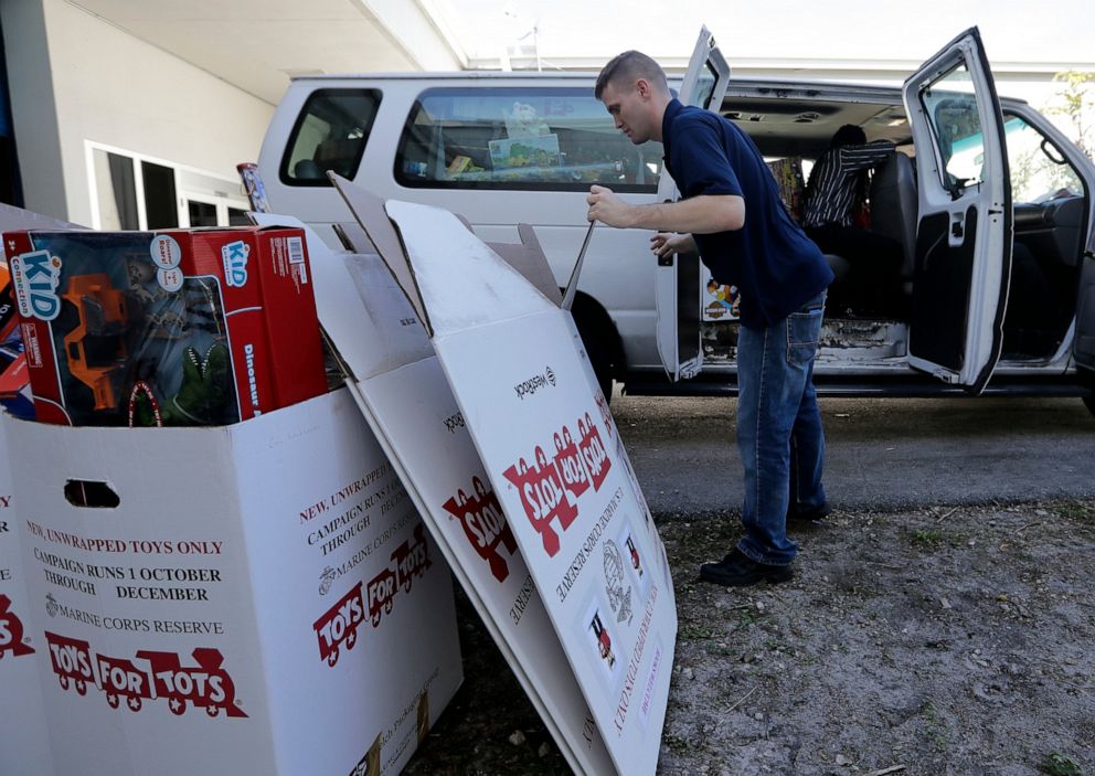 PHOTO: Staff Sgt. Brian Spittler loads a vehicle with toy donations at the Marine Corps Toys for Tots depot, Wednesday, Dec. 19, 2018, in Hialeah, Fla.