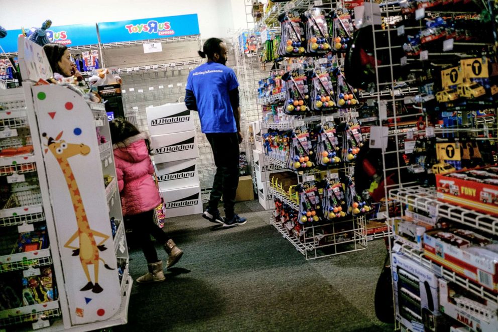 PHOTO: In this March 15, 2018, file photo, an employee walks through an aisle inside a Toys R Us Inc. retail store in New York.