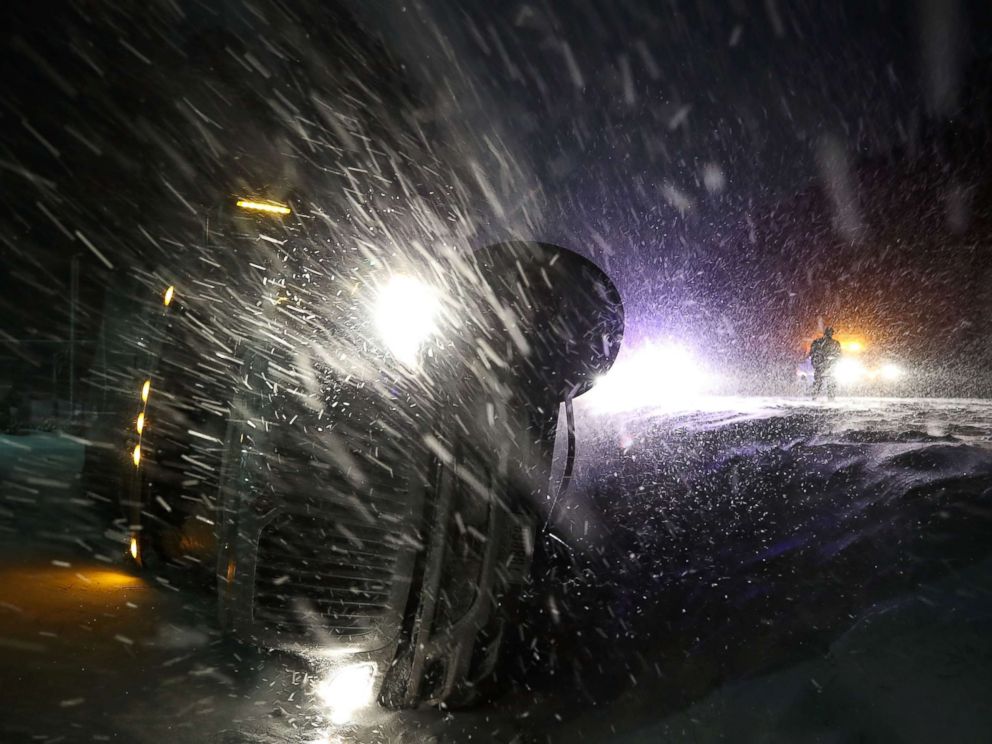 PHOTO: A tractor trailer lays on its side after running off of he road during a snow storm, Jan. 4, 2018, in Georgetown, Del. 