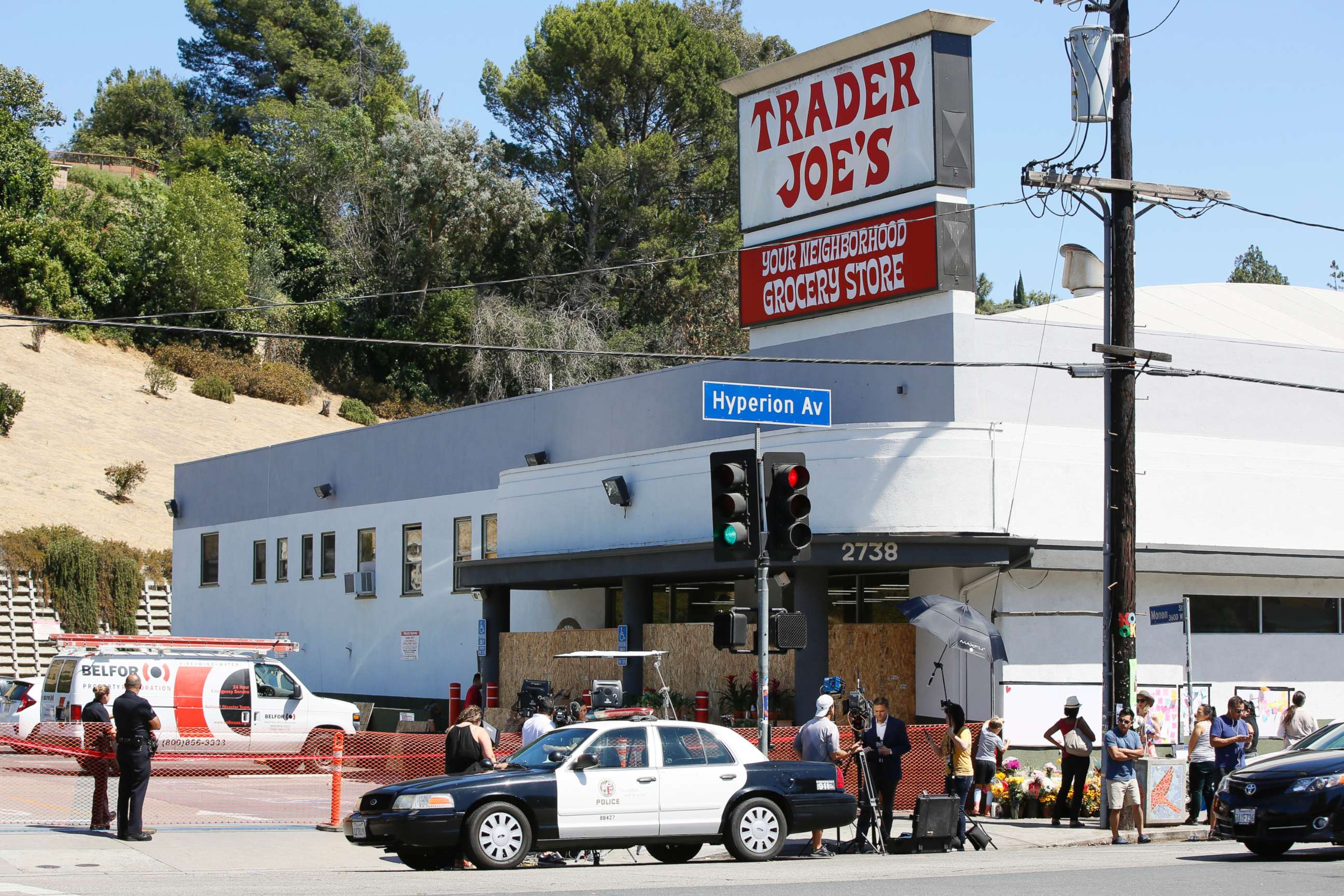 PHOTO: Police officers guard the entrance to the Trader Joe's Los Feliz store, as it remains closed for business, July 22, 2018, in Los Angeles.