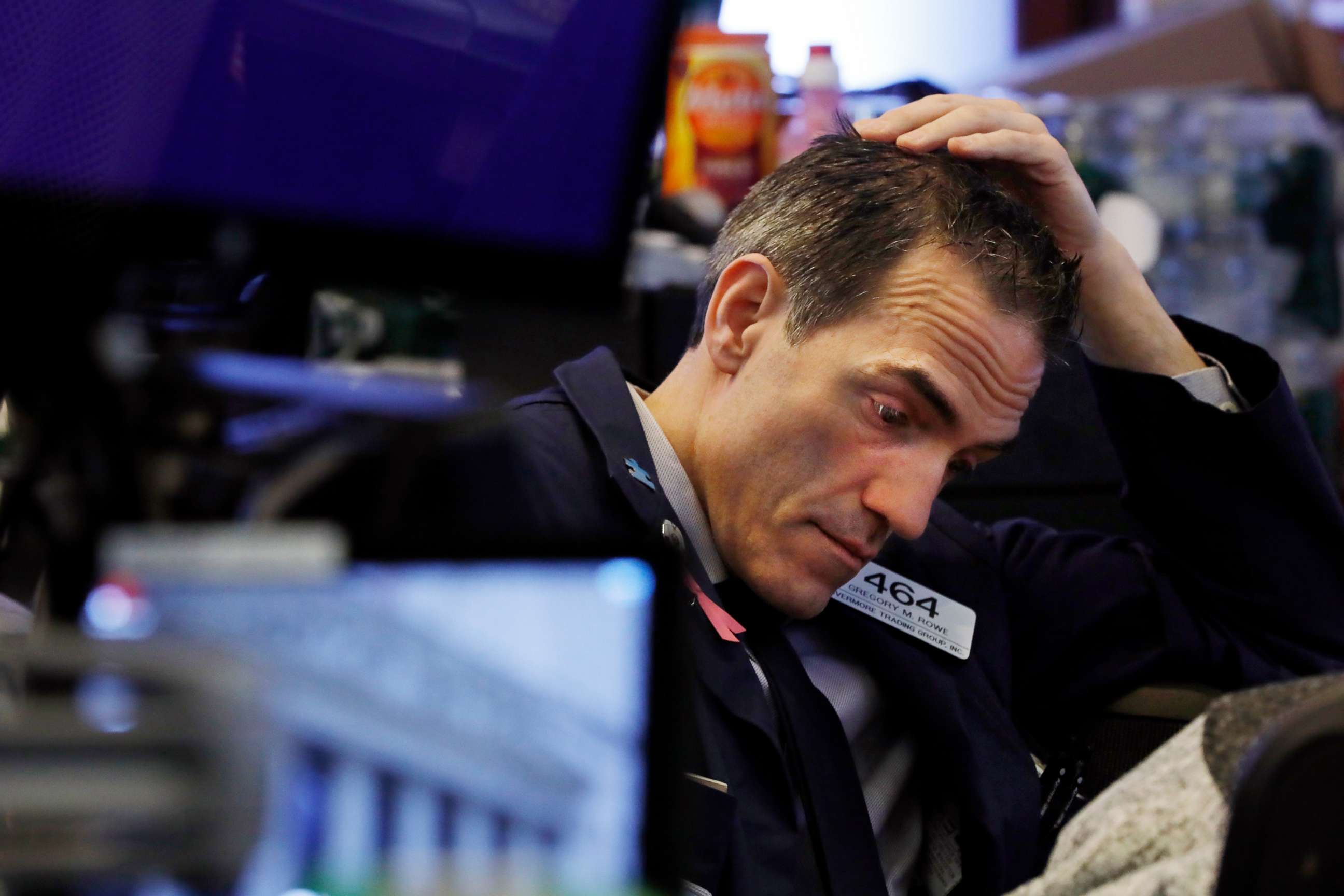 PHOTO: Trader Gregory Rowe prepares for the day's activity on the floor of the New York Stock Exchange, March 9, 2020.