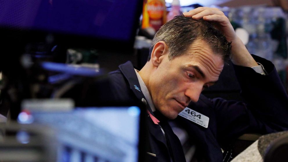 PHOTO: Trader Gregory Rowe prepares for the day's activity on the floor of the New York Stock Exchange, March 9, 2020.