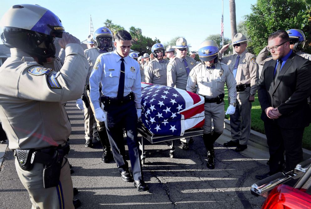 PHOTO: California Highway Patrol members bring the casket carrying CHP Officer Andre Moye Jr. to memorial services held for him in Riverside, Calif., Aug. 20, 2019. Moye was shot and killed while conducting a traffic stop near the 215 Freeway.