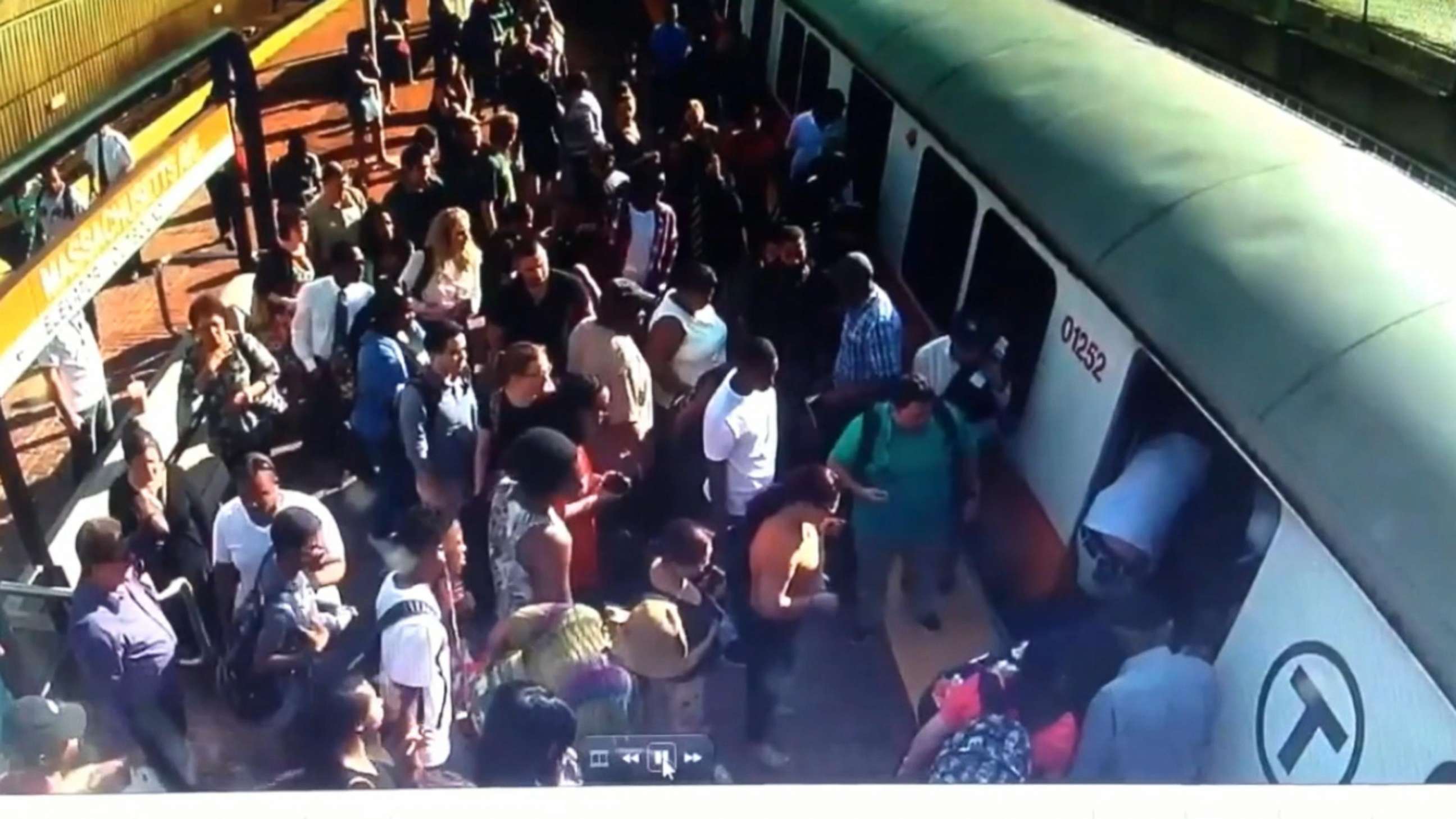 PHOTO: Video shows riders attempting to push the train to free the stranded woman in Boston, June 29, 2018.