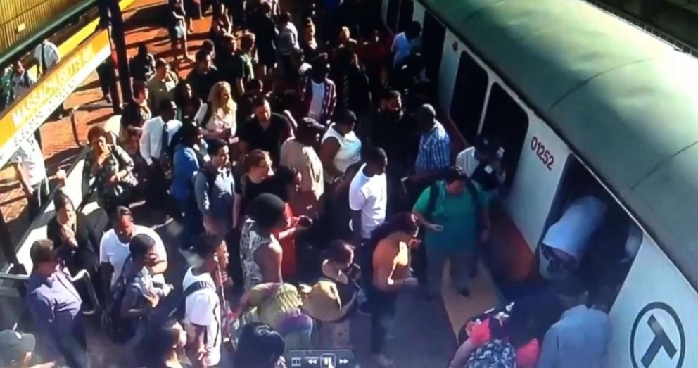 PHOTO: Video shows riders attempting to push the train to free the stranded woman in Boston, June 29, 2018.