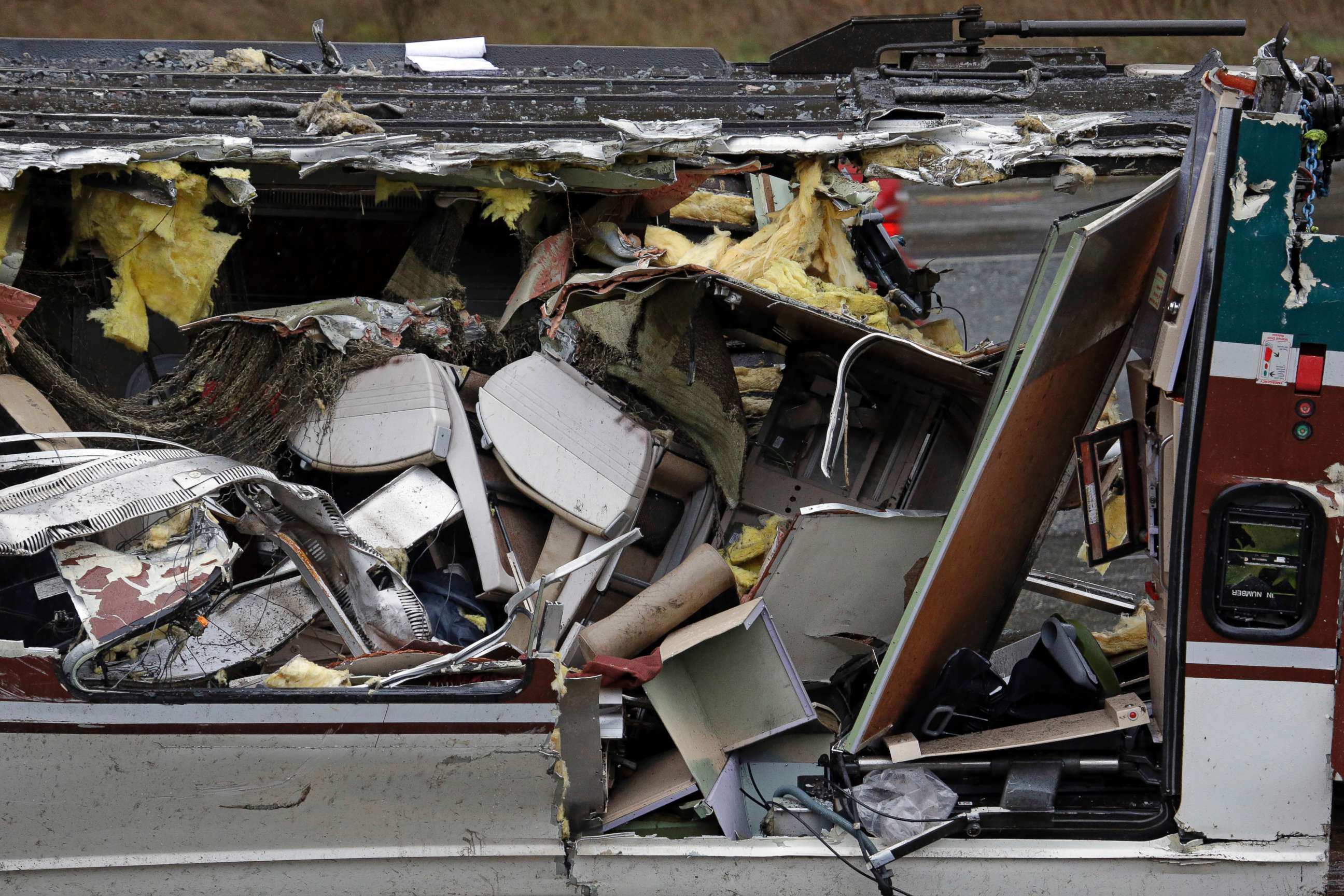 PHOTO: Seats are jammed together with other debris on an upside-down Amtrak train car sitting on a flat bed trailer taken from the scene of Monday's deadly crash onto Interstate 5, Dec. 19, 2017, in DuPont, Wash.