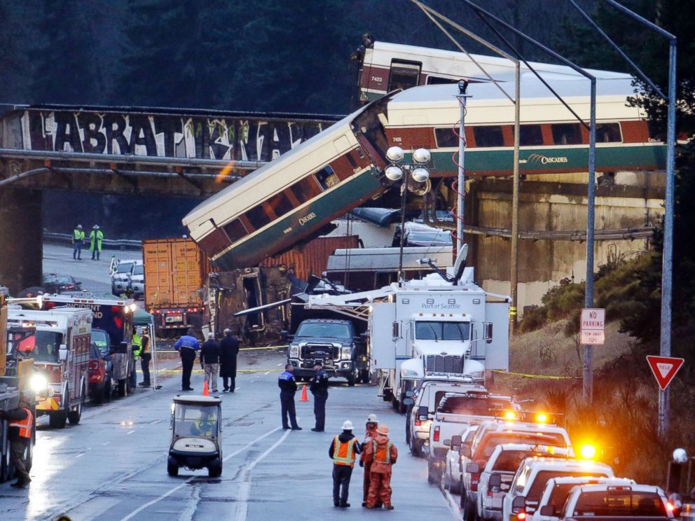 PHOTO: Lights illuminate cars from an Amtrak train that derailed above Interstate 5, Dec. 18, 2017, in DuPont, Wash.