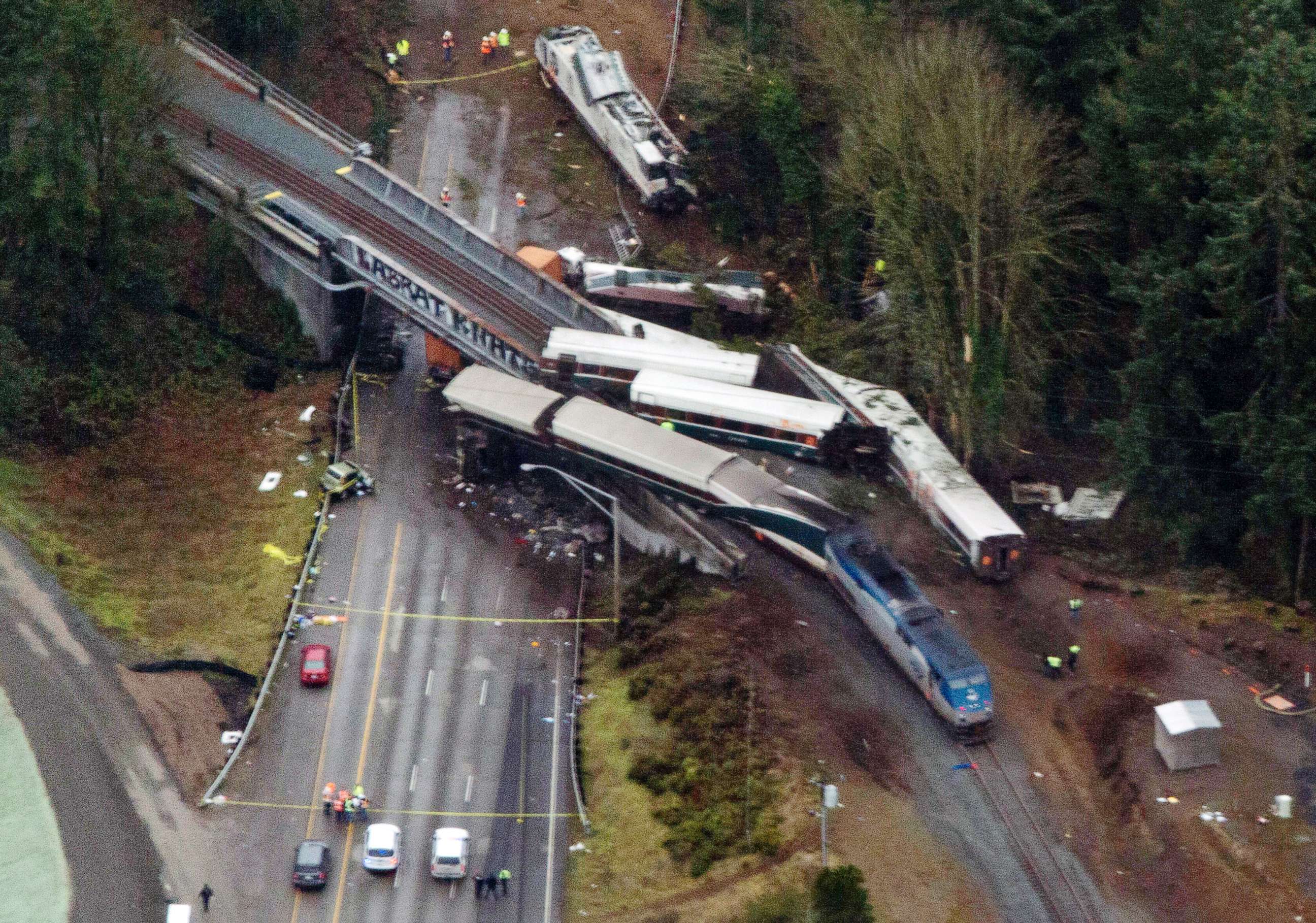PHOTO: Cars from an Amtrak train that derailed spilled onto Interstate 5, Dec. 18, 2017, in DuPont, Wash. The Amtrak train making the first-ever run along a faster new route hurtled off the overpass near Tacoma.