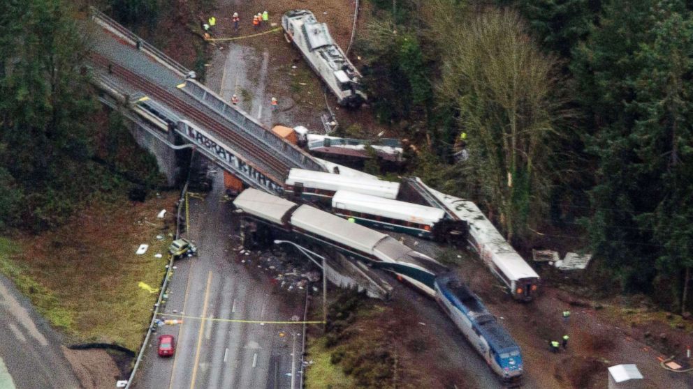Cars from an Amtrak train that derailed spilled onto Interstate 5, Dec. 18, 2017, in DuPont, Wash. The Amtrak train making the first-ever run along a faster new route hurtled off the overpass near Tacoma.