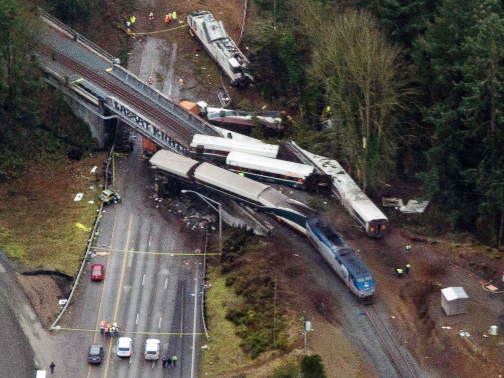 PHOTO: Cars from an Amtrak train that derailed spilled onto Interstate 5, Dec. 18, 2017, in DuPont, Wash. The Amtrak train making the first-ever run along a faster new route hurtled off the overpass near Tacoma.